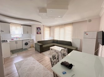 TRAMVAY DURAĞINDA EŞYALI 1+1 SATILIK DAİRE
