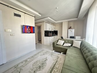 TRAMVAY DURAĞA VE SAHİLE YAKIN EŞYALI 1+1 SATILIK